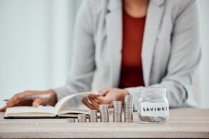 A business woman counting her personal savings at home and making a family budget for the month. A .